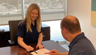 A person signing financial documents